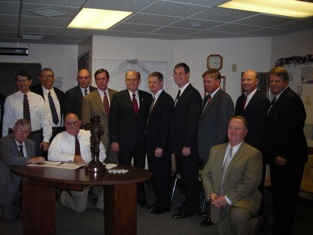 The committee presents Elder Bednar of the Quorum of the 12 Apostles of the LDS church with a maquette of the monument for the Church's use.